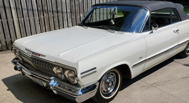 Classic white car outside