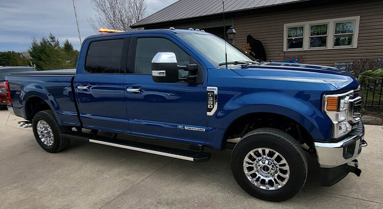 Blue pickup truck on lift